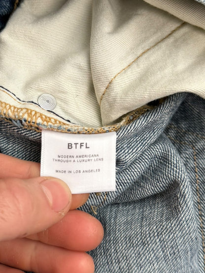 Distressed Blue Denim Jeans