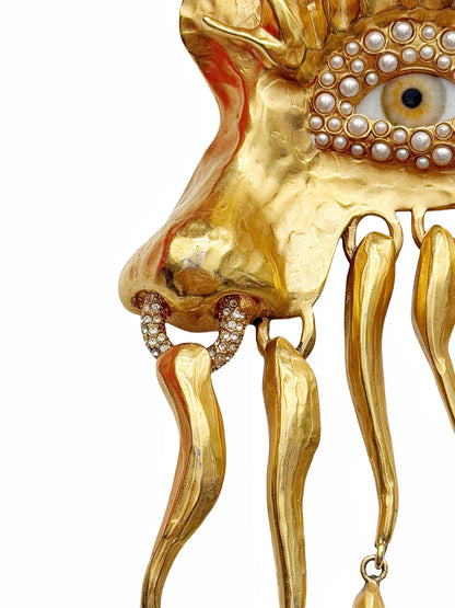 Gilded “Visage” Eye Brooch